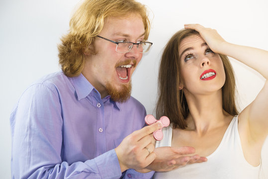 Man Showing Woman Fidget Spinner