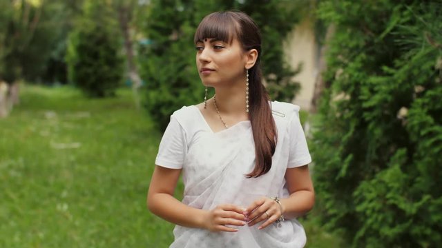 Woman in sari on nature