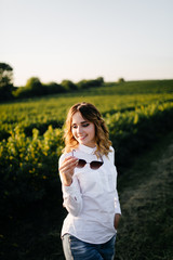Fototapeta premium A girl in a hat on a walk in the park