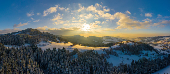 Panoramic view of the winter mountains. View from above. Landscape photo captured with drone. Silesian Beskids, Poland, Europe.
