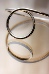  silver metal bracelet in reflection