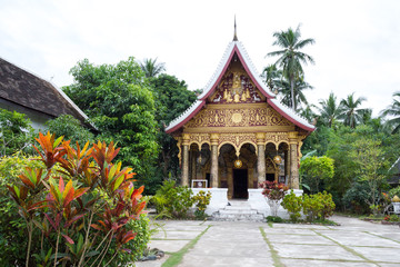 Fototapeta premium Luang Prabang, Laos – December 14, 2018: Beautiful buddhist temple in Luang Prabang old town, former capital of Laos and now a UNESCO World Heritage city.