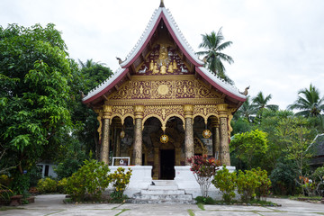 Luang Prabang, Laos – December 14, 2018: Beautiful buddhist temple in Luang Prabang old town, former capital of Laos and now a UNESCO World Heritage city.