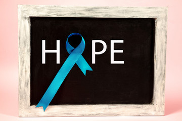 Blue ribbon symbolic of prostate cancer awareness campaign and men's health in November. The...