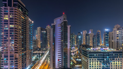 Fototapeta na wymiar Aerial view of Dubai Marina from a vantage point night timelapse.