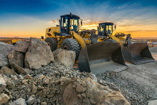 Two excavators removing stone in the construction works of a road
