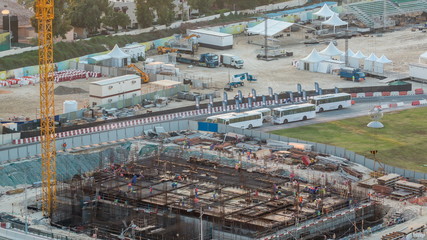 Fototapeta premium Construction site with crane at Dubai Marina timelapse. Building of skyscrapers.