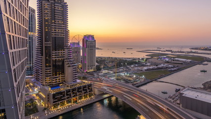 Fototapeta na wymiar JBR and Dubai marina after sunset aerial day to night timelapse