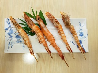 Top view of grilled shrimps on skewers, japan food in Restaurant
