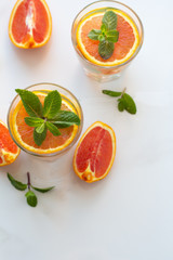 drink with red orange and mint leaves top view close-up and space for text.