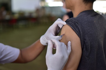 doctor with syringe in hand