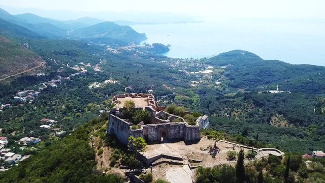Aerial drone video of iconic castle of Ali Pasha overlooking bay and village of Parga, Epirus, Ionian, Greece