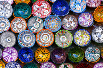 Moroccan pottery in Essaouira. Colorful ceramics and pottery displayed outside a shop. Beautiful...