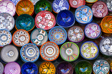 Essaouira, Morocco - October 1, 2018: Moroccan pottery in Essaouira. Colorful ceramics and pottery displayed outside a shop. Beautiful oriental design with plenty of colors.
