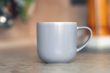 Gray mug on kitchen work surface