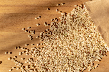 Raw Brown Rice On A wooden table. Organic Brown Rice On A table.