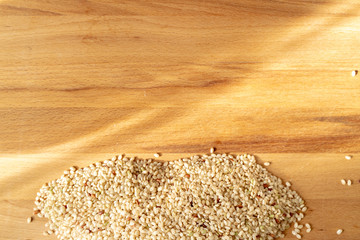 Raw Brown Rice On A wooden table. Organic Brown Rice On A table.