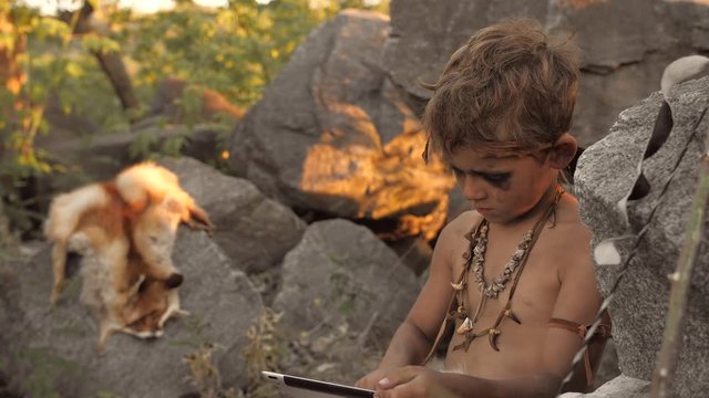 Caveman, manly boy making using tablet PC