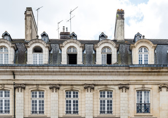 Fototapeta na wymiar Detail of facade and mansard of old residential in Rennes