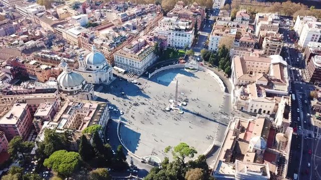 Aerial drone view rotational video of iconic Piazza del Popolo (People's Square) named after the church of Santa Maria del Popolo in the heart of Rome, Italy