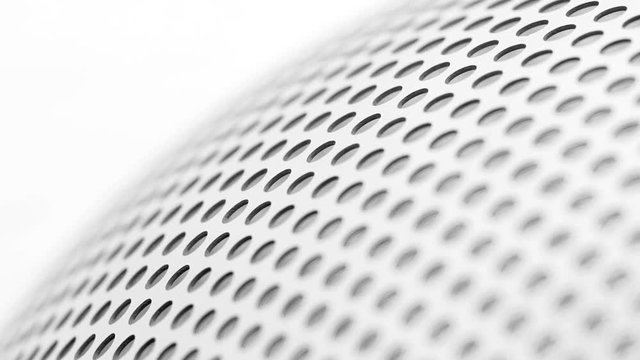Rotated perforated steel surface background.