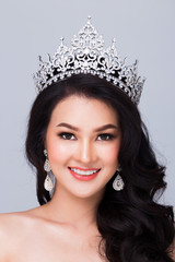 Portrait of Miss Pageant Contest in Asian Red Sequin Evening Ball Gown dress with Silver Diamond Crown Sash, fashion make up face hair style, studio lighting white background isolated copy space © Jade
