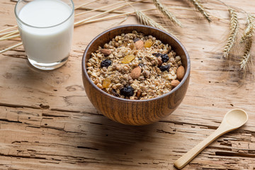 Mixed Muesli with a glass of Milk on wooden background
