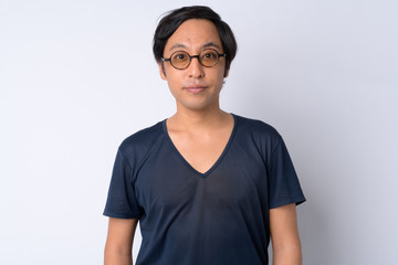 Portrait of Japanese man against white background