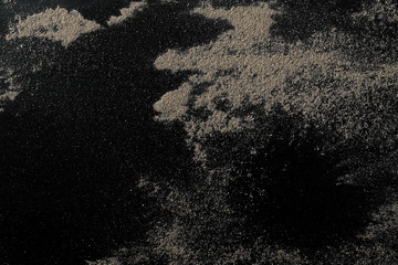 Desert sand isolated on black background and texture, with clipping path, top view