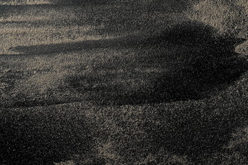 Desert sand isolated on black background and texture, with clipping path, top view