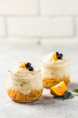 Coconut milk rice pudding with citrus jam. Selective focus, space for text.