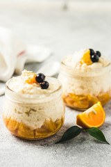 Coconut milk rice pudding with citrus jam. Selective focus, space for text.