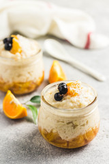 Coconut milk rice pudding with citrus jam. Selective focus, space for text.