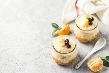 Creamy vanilla rice pudding with citrus jelly and berries. Selective focus, space for text.