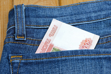 Russian money in the pocket of jeans. Banknote 5000 rubles