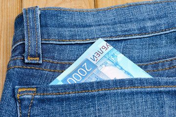 Russian money in the pocket of jeans. Banknote 2000 rubles