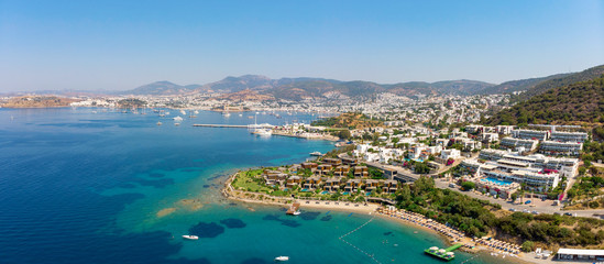 Naklejka na ściany i meble Panoramic aerial view of sunny Bodrum with resorts and beachfront villas
