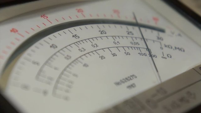 Electric Voltage Meter.Electrician using voltmeter for checking office equipment