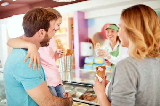 Young family at pastry shop