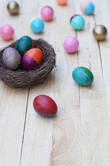Obraz na płótnie Canvas Decorative colorful painting easter eggs in nest, fun event activity for kid concept