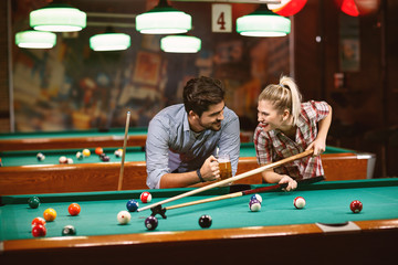 billiard game - couple spending time together  .