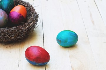 Decorative colorful painting easter eggs in nest, fun event activity for kid concept