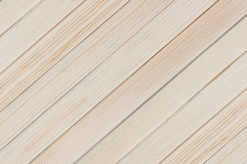 Obraz premium Natural background of new wooden light plank boards diagonal