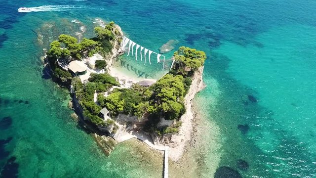 Aerial drone view video of famous islet of Cameo in Agios Sostis area of Laganas, Zakynthos island, Ionian Greece
