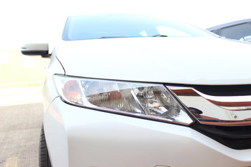 white honda Car headlight and headlamps close up sports family - obrazy, fototapety, plakaty