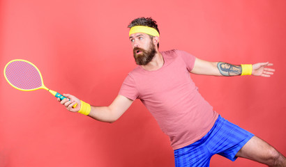 Man bearded hipster wear sport outfit. Tennis player beginner retro fashion. Concentrated on tennis...
