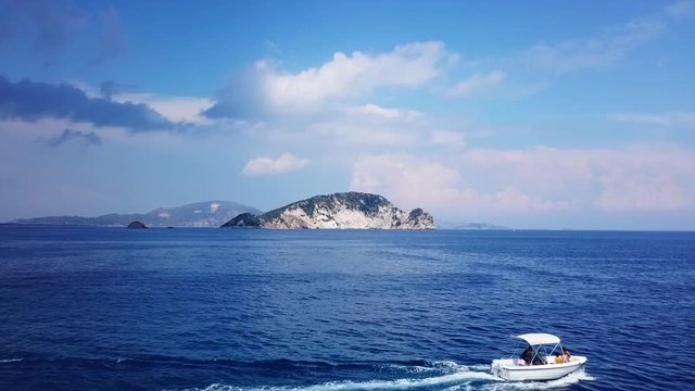 Aerial drone video from famous for Caretta caretta sea turtle haching, exotic small island of Marathonisi with white caves and sapphire sea and sandy beach , Zakynthos island, Ionian, Greece