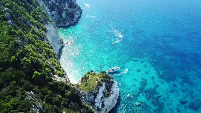 Aerial drone video from famous for Caretta caretta sea turtle haching, exotic small island of Marathonisi with white caves and sapphire sea and sandy beach , Zakynthos island, Ionian, Greece