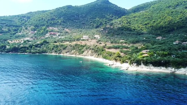 Aerial drone video from famous for Caretta caretta sea turtle haching, exotic small island of Marathonisi with white caves and sapphire sea and sandy beach , Zakynthos island, Ionian, Greece