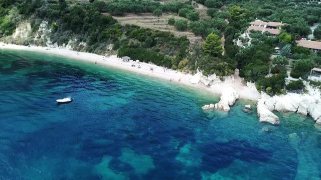 Aerial drone video from famous for Caretta caretta sea turtle haching, exotic small island of Marathonisi with white caves and sapphire sea and sandy beach , Zakynthos island, Ionian, Greece